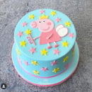 A Peppa Pig cake with pink frosting
