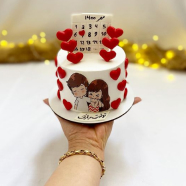 Anniversary Cake featuring a couple, held by a hand